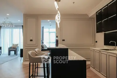 Luxurious modern kitchen with elegant lighting and open layout