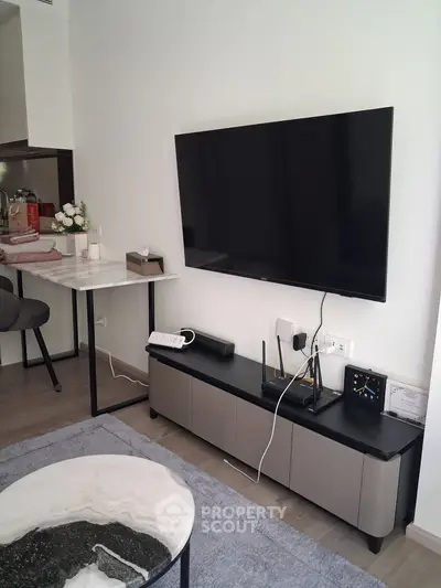Modern living room with sleek TV setup and stylish furniture