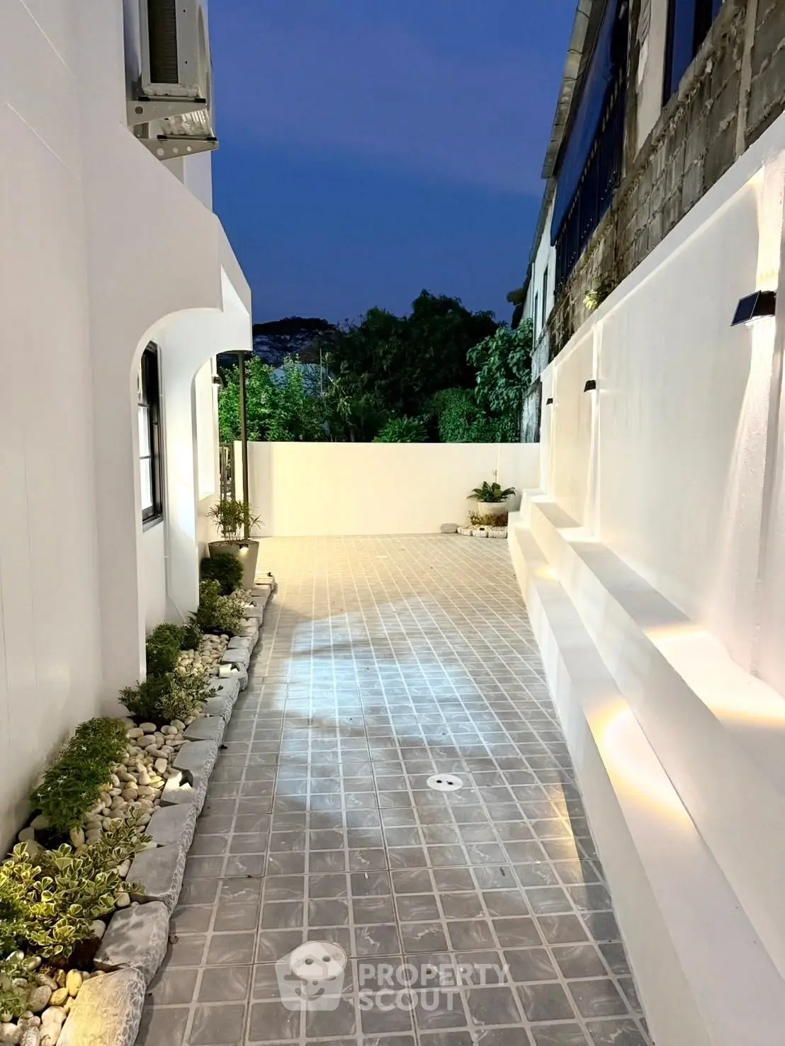Elegant modern exterior with stylish lighting and sleek walkway