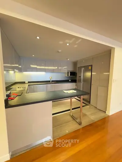 Modern kitchen with sleek cabinetry and stainless steel appliances