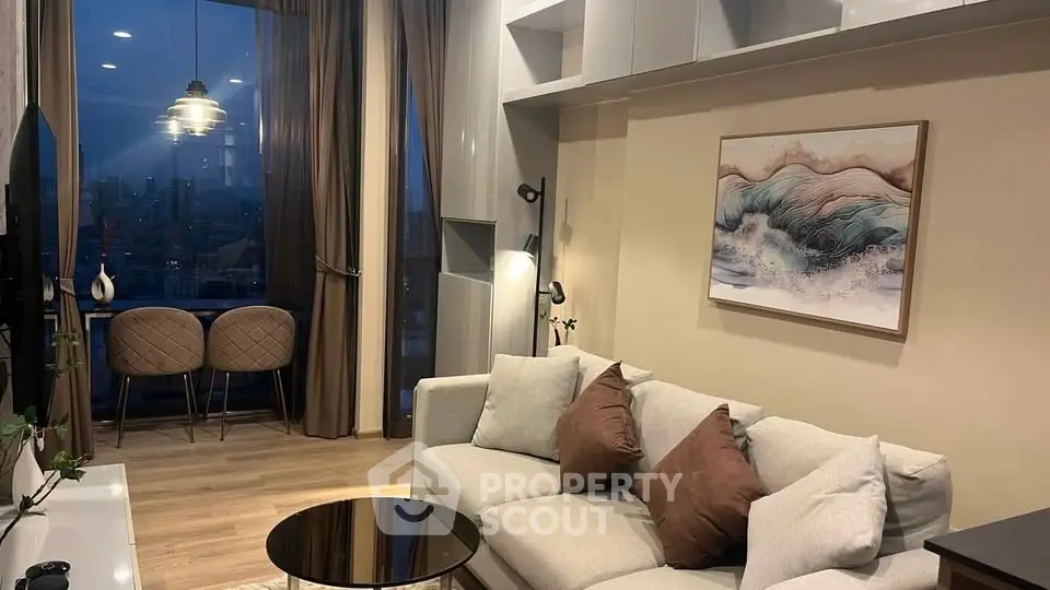 Stylish modern living room with city view, elegant decor, and cozy seating area.