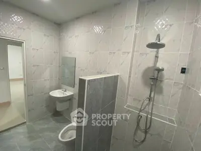 Modern bathroom with sleek shower and elegant tile design