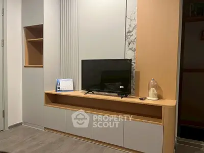 Modern living room with sleek TV unit and stylish decor