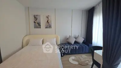 Modern bedroom with stylish decor and cozy seating area