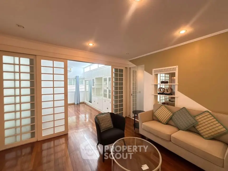 Spacious living room with elegant sliding doors and cozy seating area