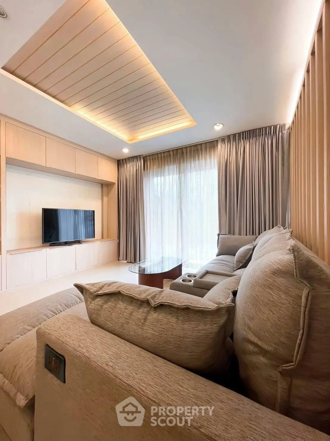 Luxurious living room with modern design, cozy seating, and elegant lighting, perfect for relaxation and entertainment.