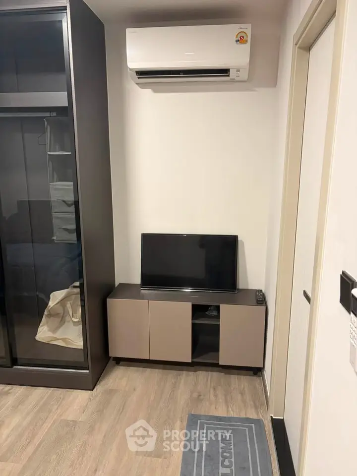 Modern compact living room with air conditioning and sleek furniture