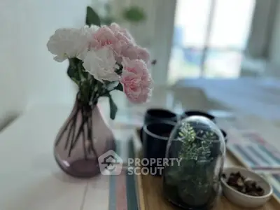 Charming interior with elegant floral arrangement and modern decor, perfect for a cozy living space.