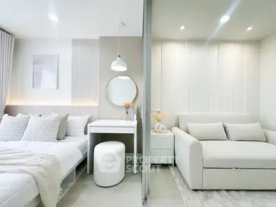 Modern studio apartment with stylish bedroom and cozy living area, featuring elegant decor and soft lighting.