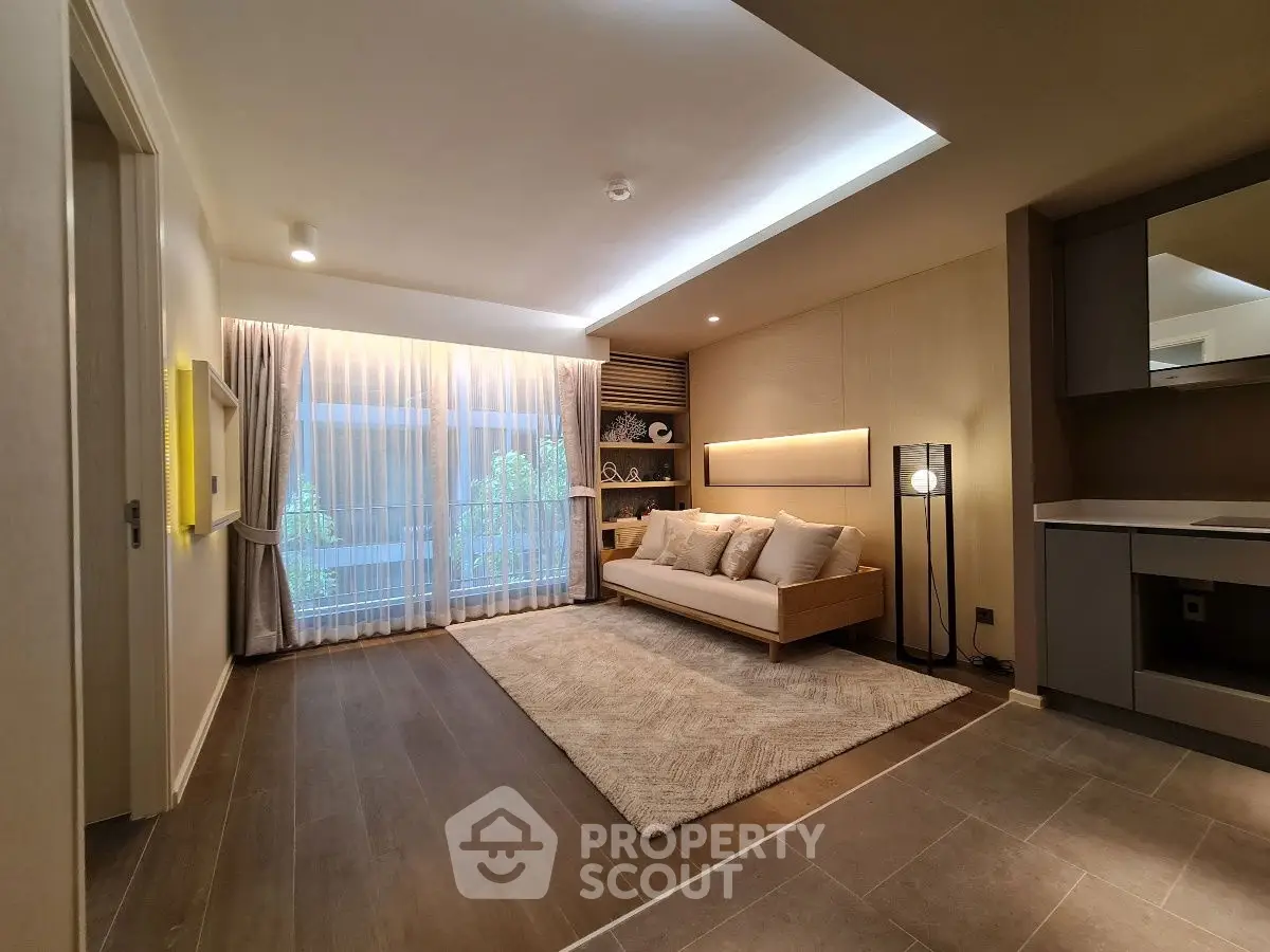 Modern living room with elegant decor and large window view