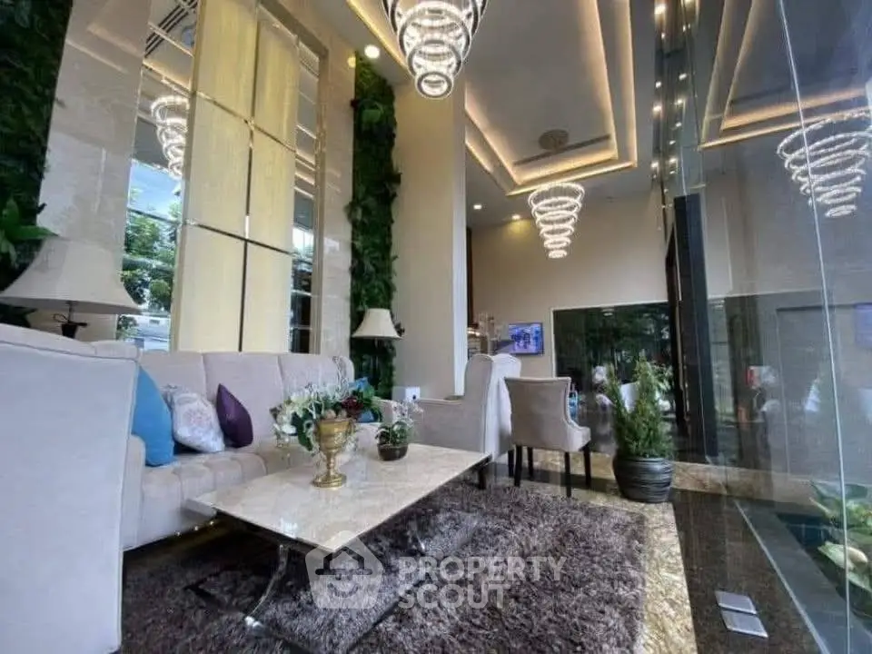 Luxurious modern living room with elegant lighting and plush furnishings in a high-end property.