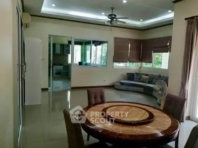 Spacious living room with dining area and modern kitchen view