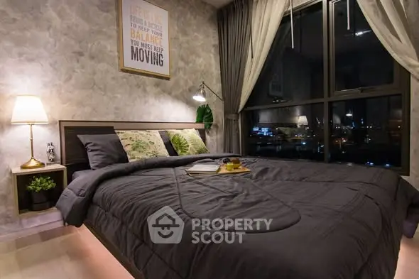 Cozy modern bedroom with large window and stylish decor