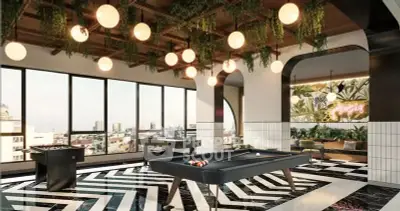 Luxurious game room with pool table and stunning city views in modern apartment complex.