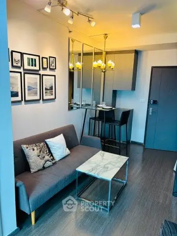 Modern living room with stylish decor and compact dining area