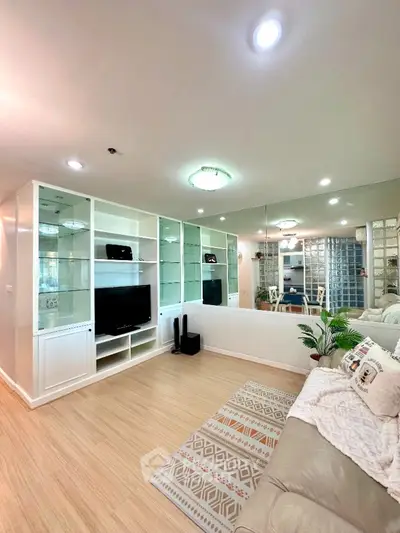 Spacious living room with modern decor and built-in shelving unit