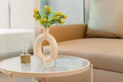 Stylish modern living room with elegant decor and cozy seating area.