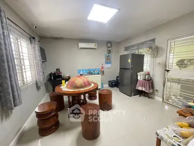 Spacious kitchen with modern appliances and wooden dining set