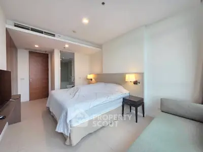 Spacious modern bedroom with cozy lighting and elegant decor