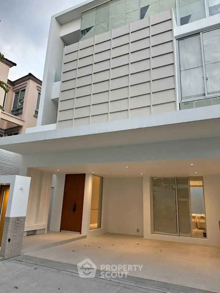 Modern minimalist exterior with sleek design and spacious entrance