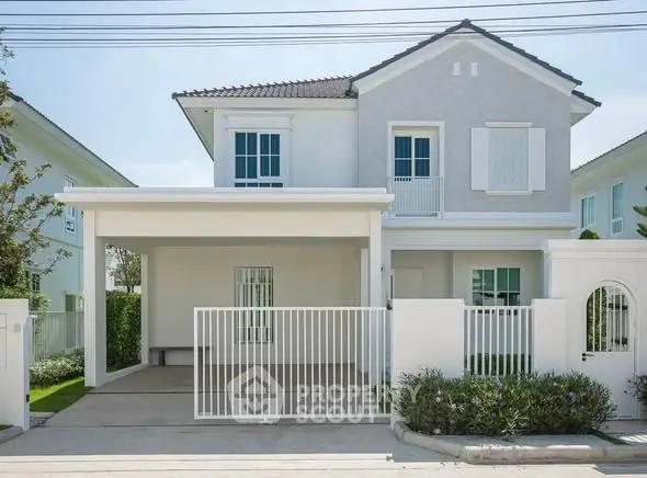 Charming two-story house with modern design and spacious driveway in a serene neighborhood.