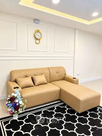 Stylish living room with modern beige sofa and elegant decor