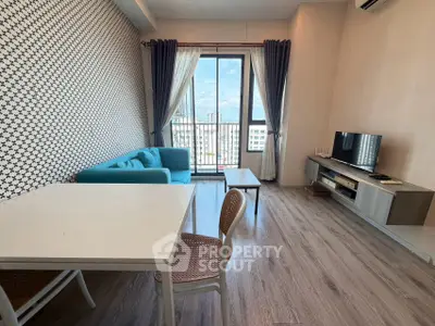 Modern living room with stylish decor and city view balcony