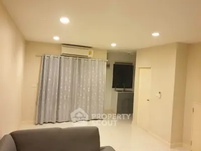 Cozy living room with air conditioning and modern lighting