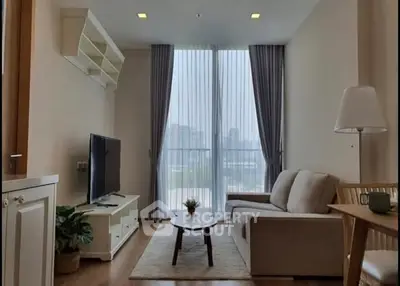 Modern living room with large windows and stylish furniture