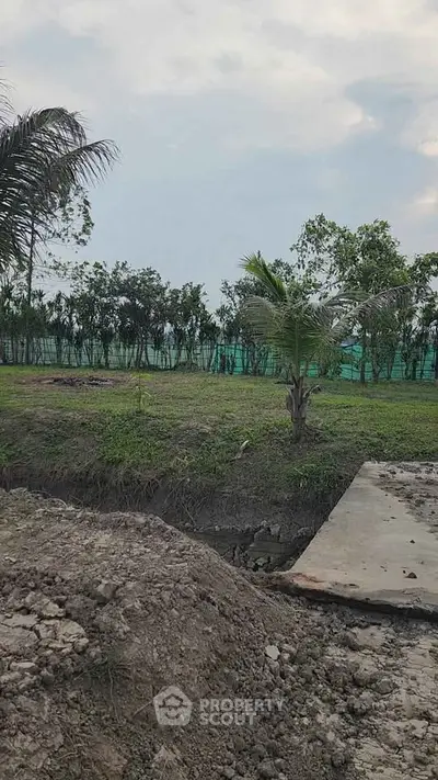 Expansive plot of land with lush greenery, perfect for development or investment opportunities.