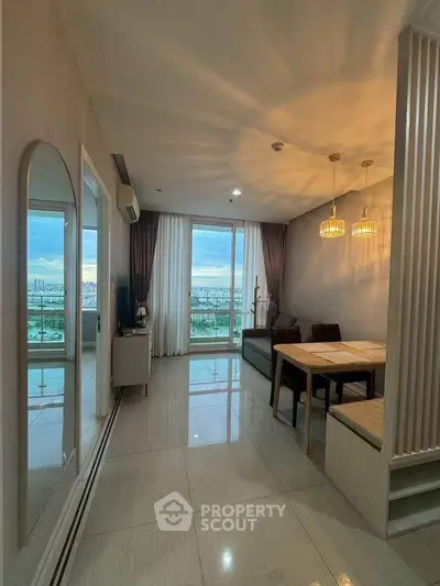 Modern living room with city view, elegant lighting, and stylish furniture in a high-rise apartment.