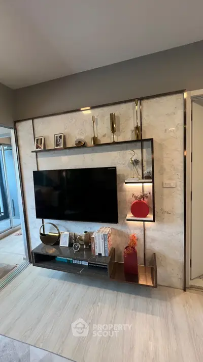 Modern living room with stylish TV unit and decorative accents
