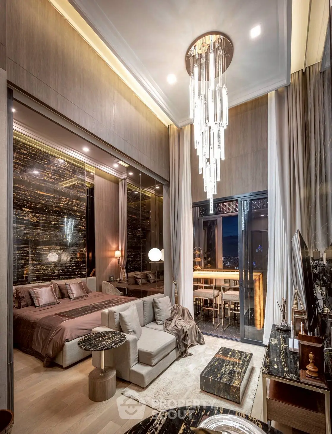 Luxurious modern bedroom with elegant decor and stunning chandelier lighting.