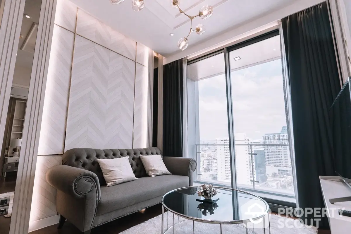 Luxurious living room with elegant sofa, chic decor, and floor-to-ceiling windows offering an expansive city view, perfect for upscale urban living.