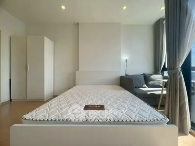 Modern bedroom with minimalist design and large window for natural light