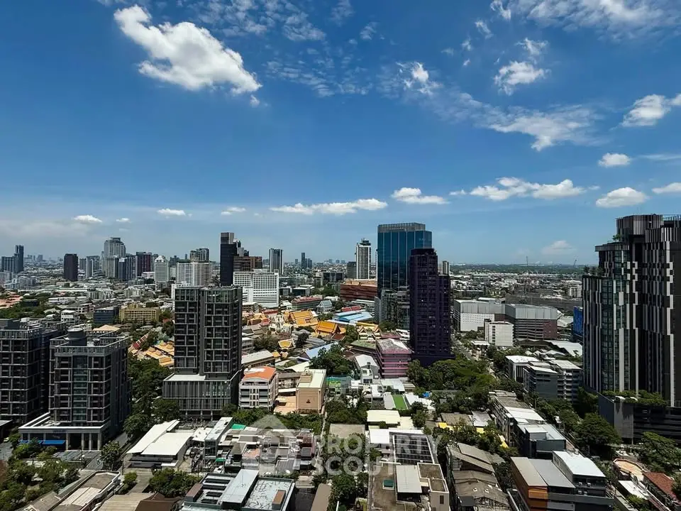 Stunning cityscape view showcasing modern skyscrapers under a clear blue sky, perfect for urban living.