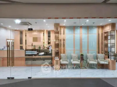 Elegant office lobby with modern glass doors and stylish seating area