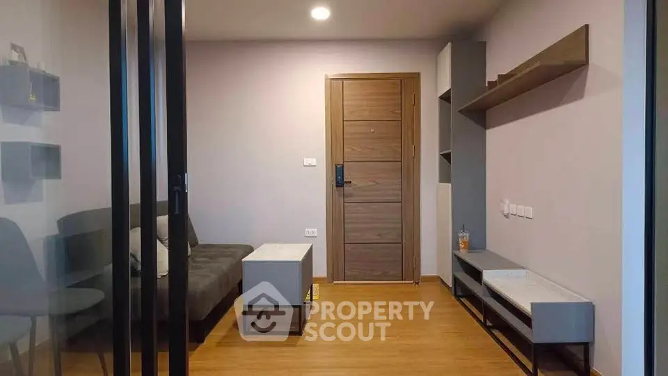 Modern living room with sleek furniture and wooden flooring