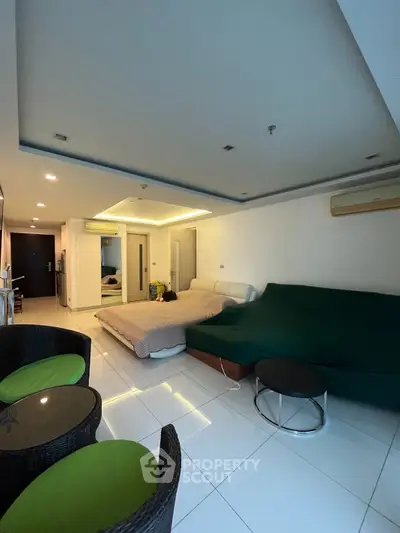 Modern studio apartment with stylish furnishings and bright lighting