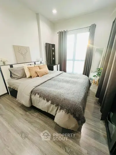 Cozy modern bedroom with stylish decor and natural light