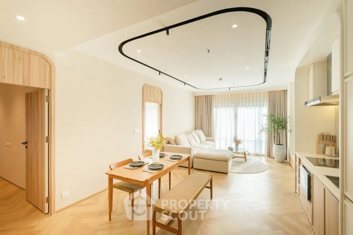 Spacious modern living room with open kitchen and elegant dining area