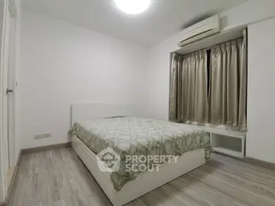 Cozy minimalist bedroom with modern air conditioning and elegant decor