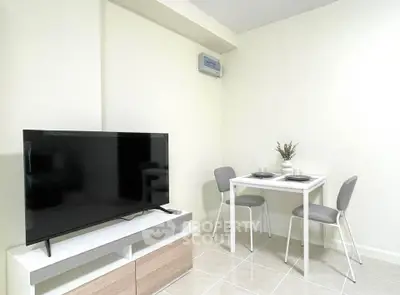 Modern living room with TV and dining area in minimalist apartment