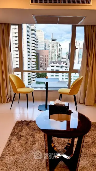 Modern high-rise apartment with city view and stylish interior seating area.