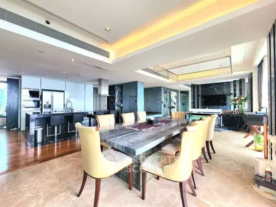 Luxurious open-plan living and dining area with modern kitchen and elegant decor