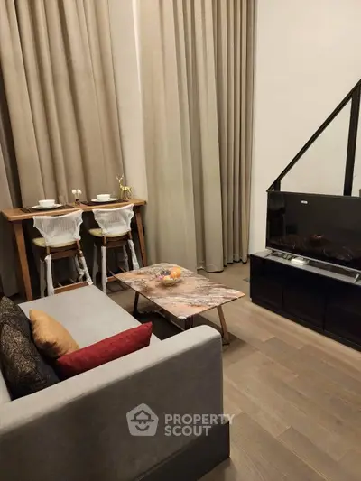 Modern living room with stylish decor and cozy dining area