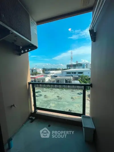 Charming balcony with city view, perfect for relaxation and enjoying the skyline.