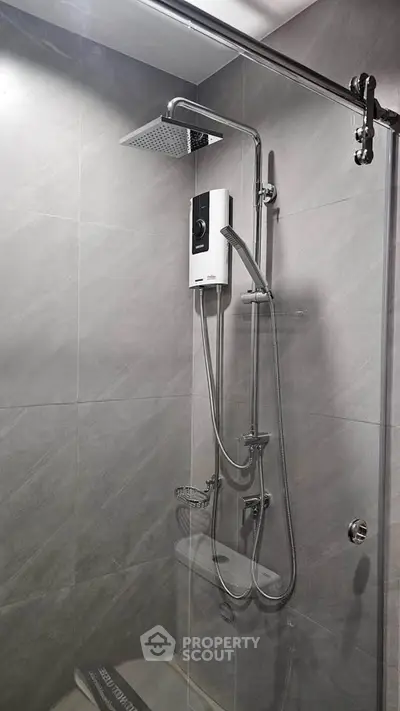 Modern bathroom with sleek shower fixtures and glass enclosure