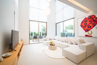 Luxurious modern living room with high ceilings and elegant decor