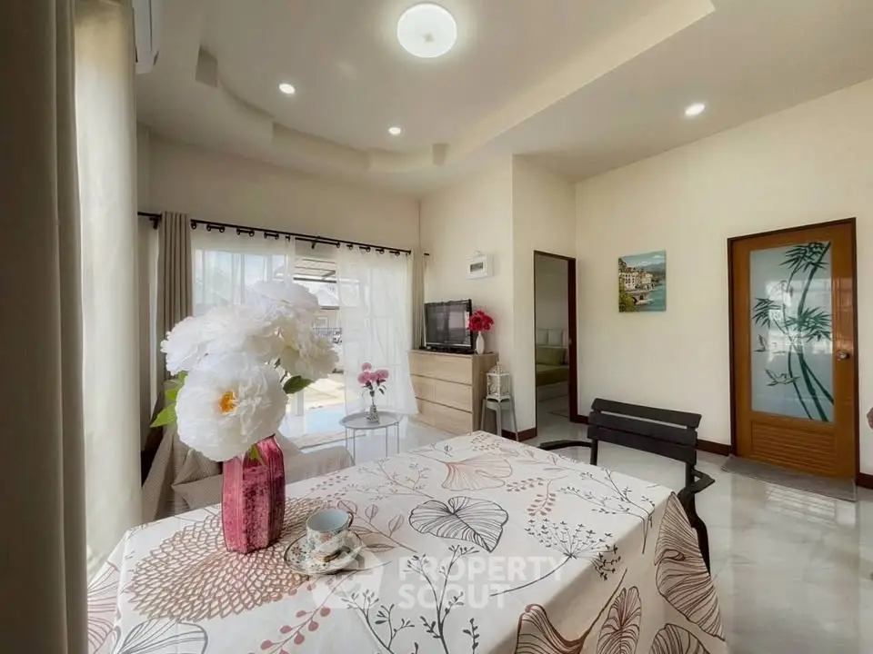 Bright living room with floral decor and modern furnishings